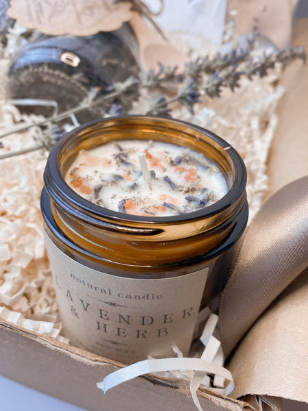 cozy gift with socks, calming candle, tea, and handmade journal